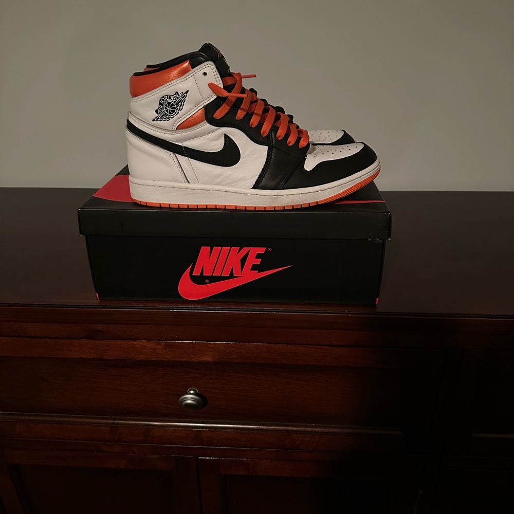Nike High-Top Sneakers in Black, White, and Orange